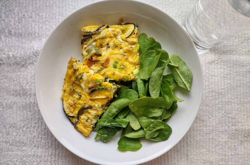 Frittata and spinach on a plate