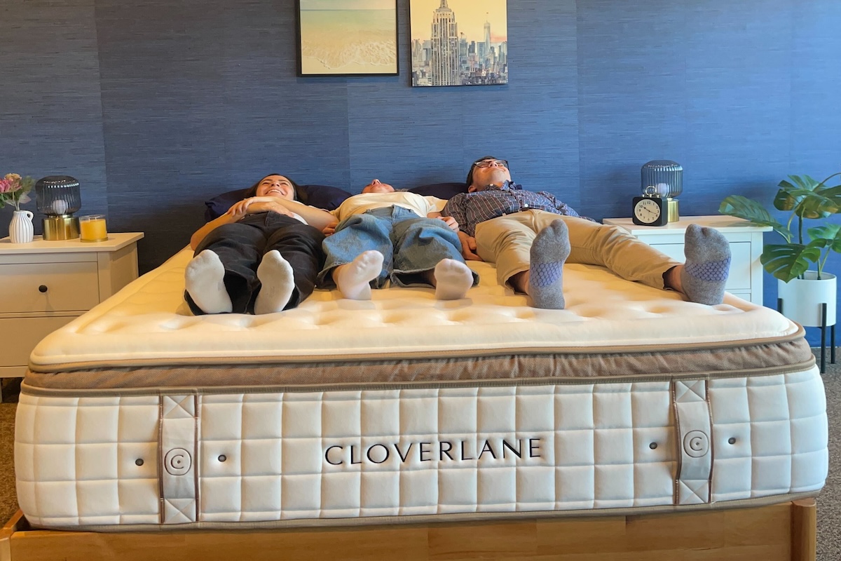 Three people lying on a Cloverlane mattress