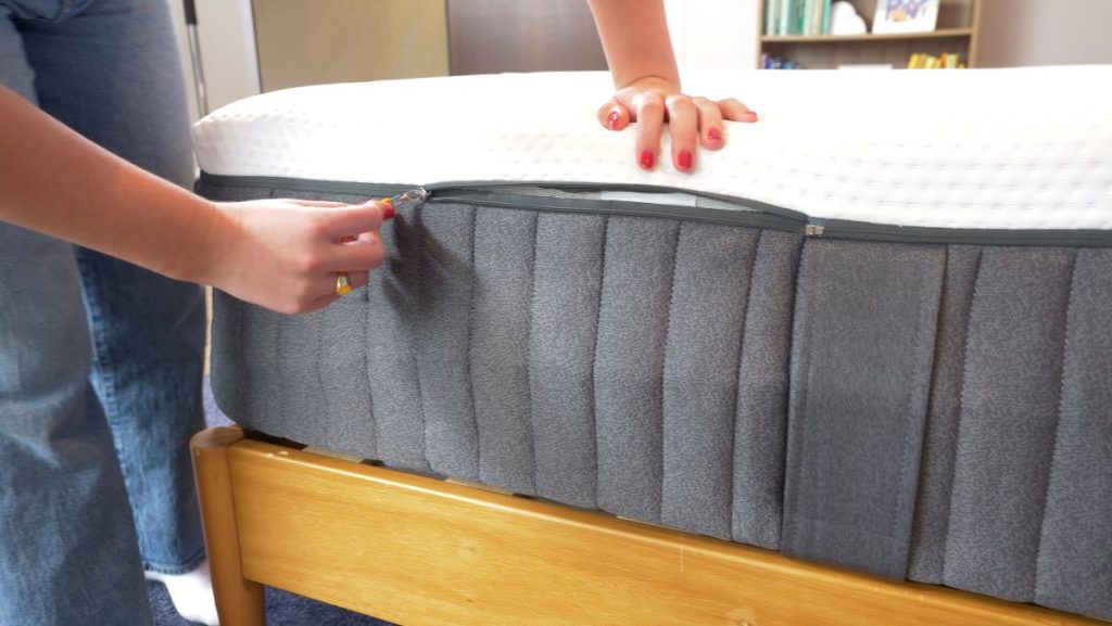 Photo of the side of the Emma Hybrid Comfort mattress, showing the zip-off cover.