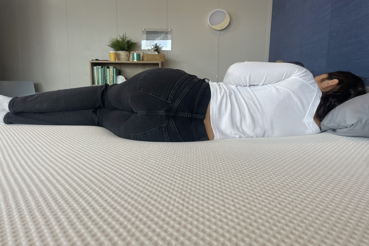 Person sleeping on their side on a Nectar Memory Foam mattress