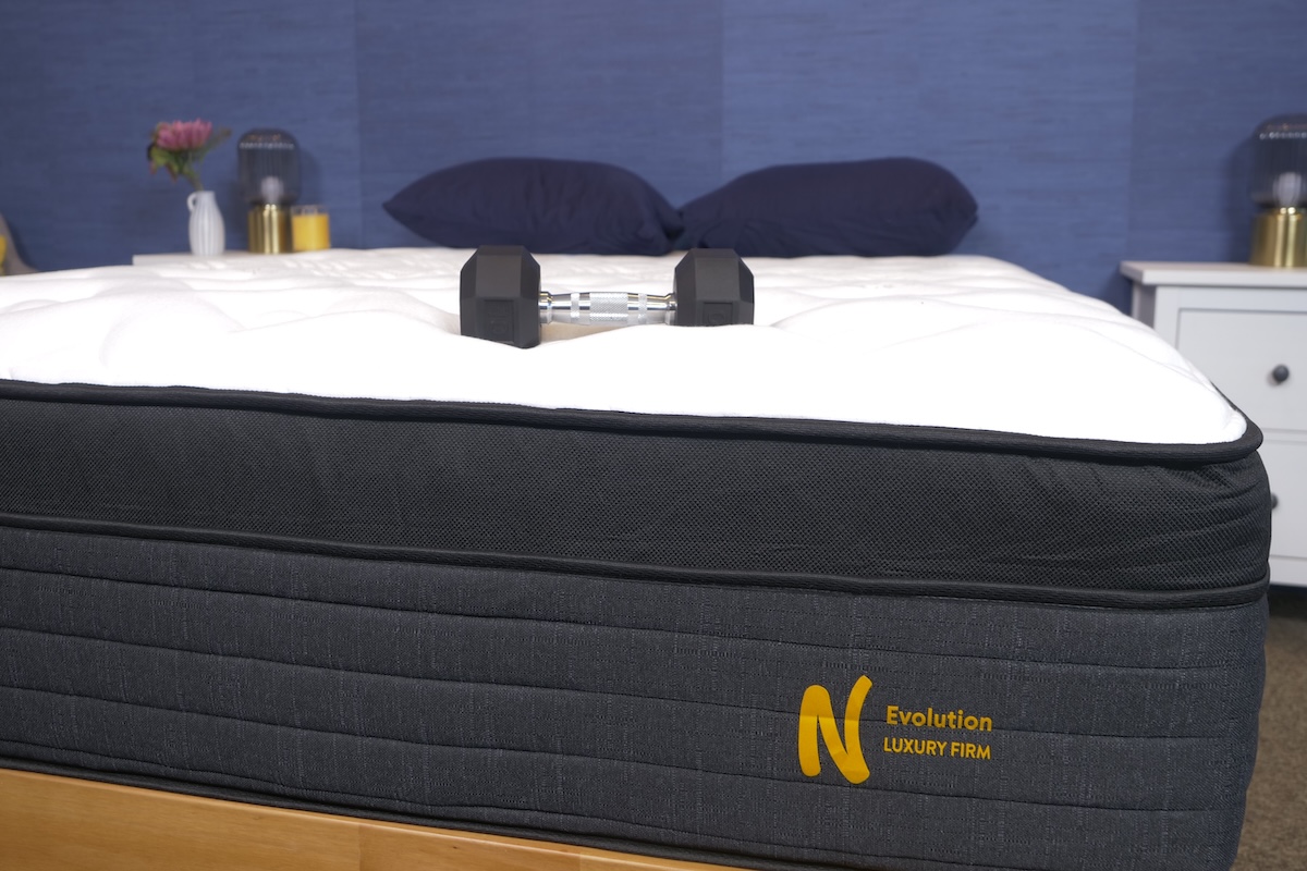  Nolah Evolution hybrid Mattress with heavy weights on top to test for motion transfer and plushness
