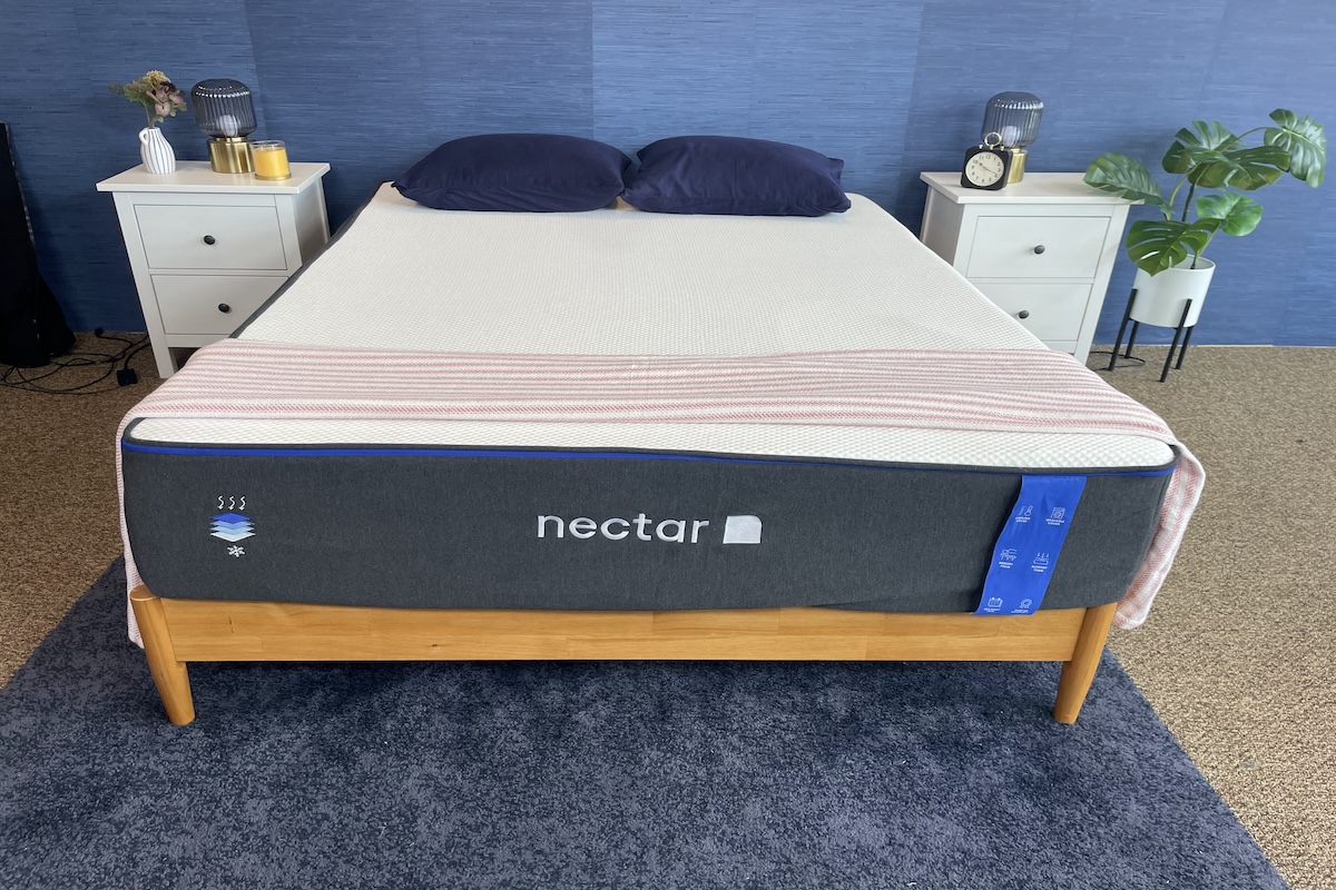 Nectar Memory Foam mattress on a light wood bed base in a bedroom display setting 
