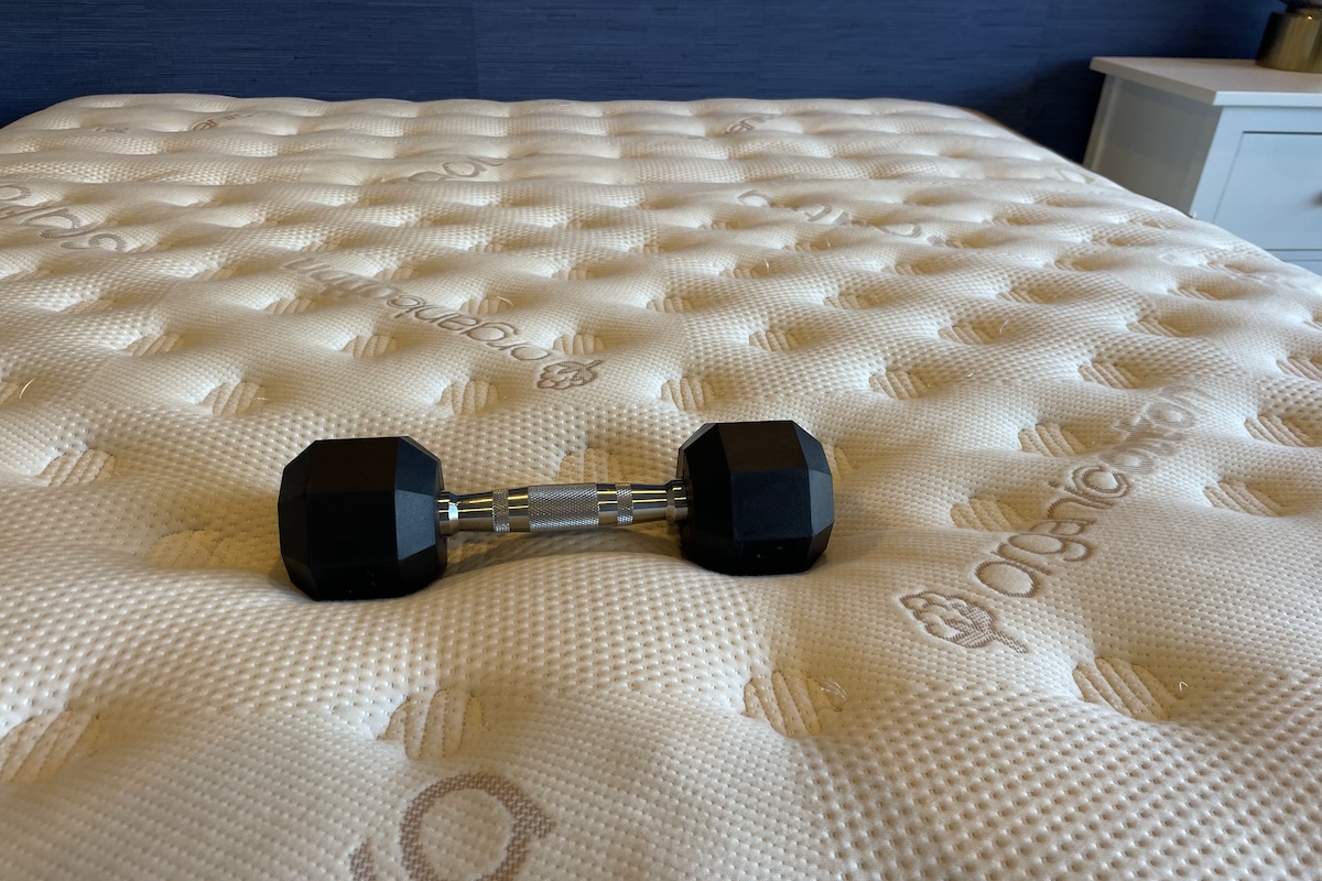 10-pound dumbbell on a Saatva Classic mattress