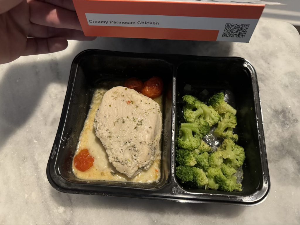Tray of cooked chicken and broccoli