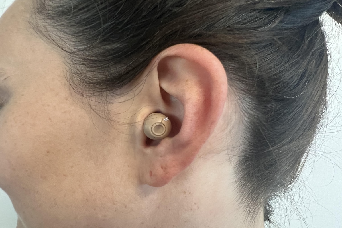 Side view of a woman with an Audien Atom Pro 2 in her ear 