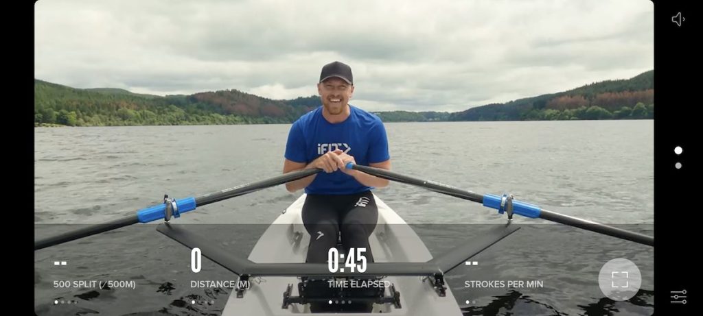  Screenshot of an iFIt trainer leading a rowing class in the middle of a lake