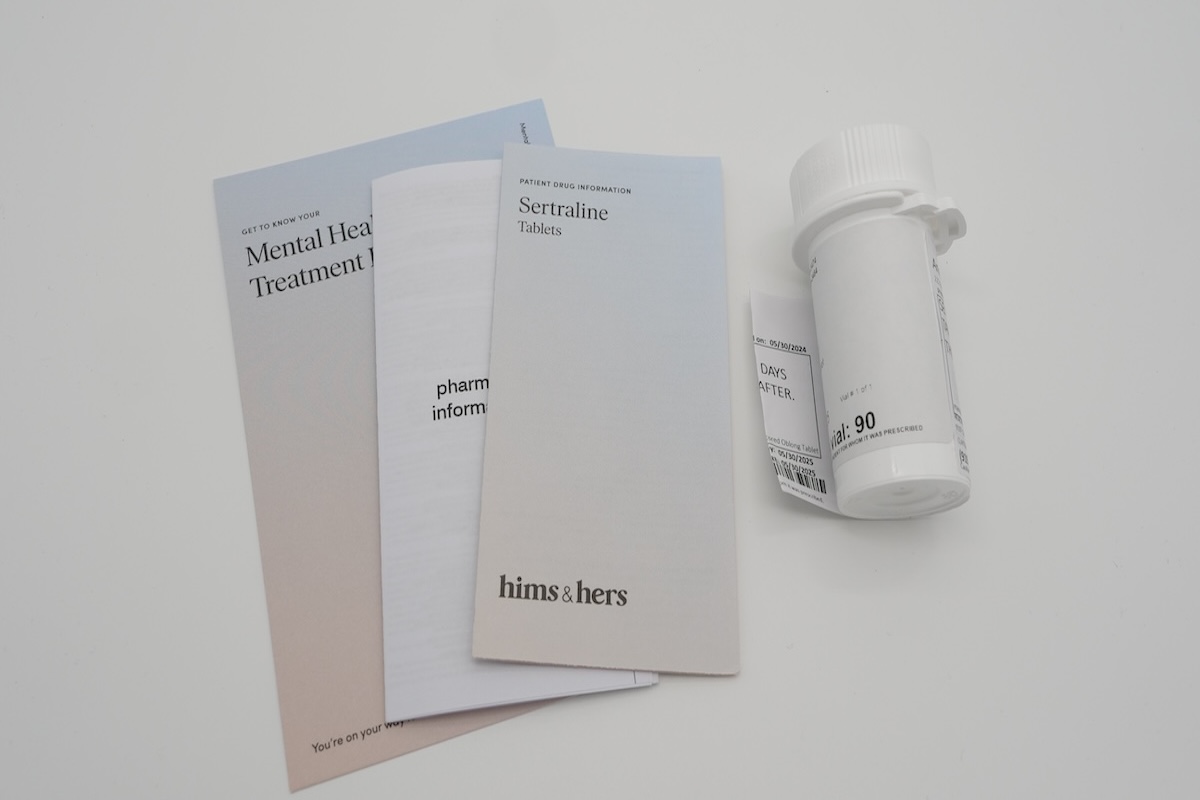 A Hers medication delivery bottle and related literature.
